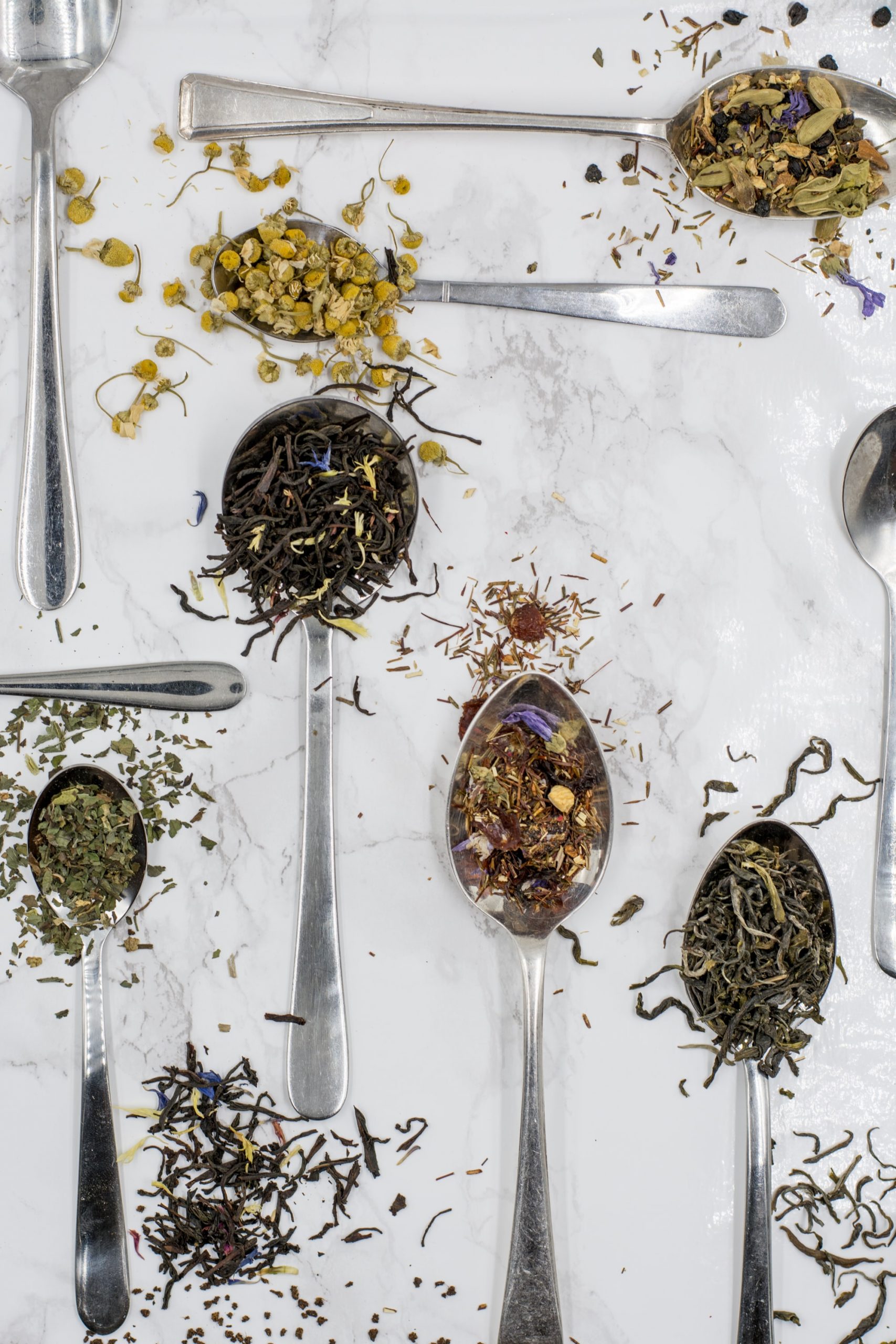 image of tea leaves on spoons