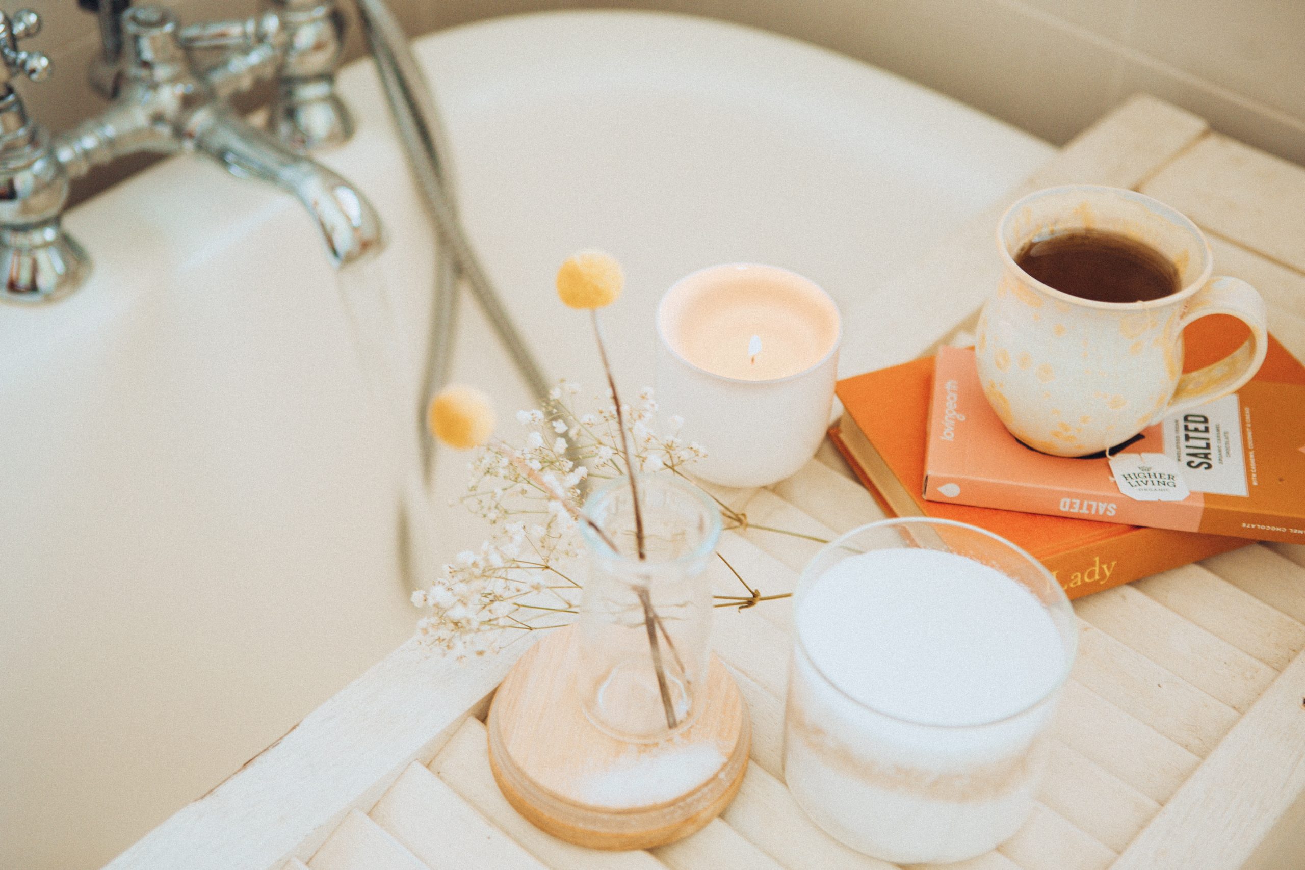 bath tub with candles and tea